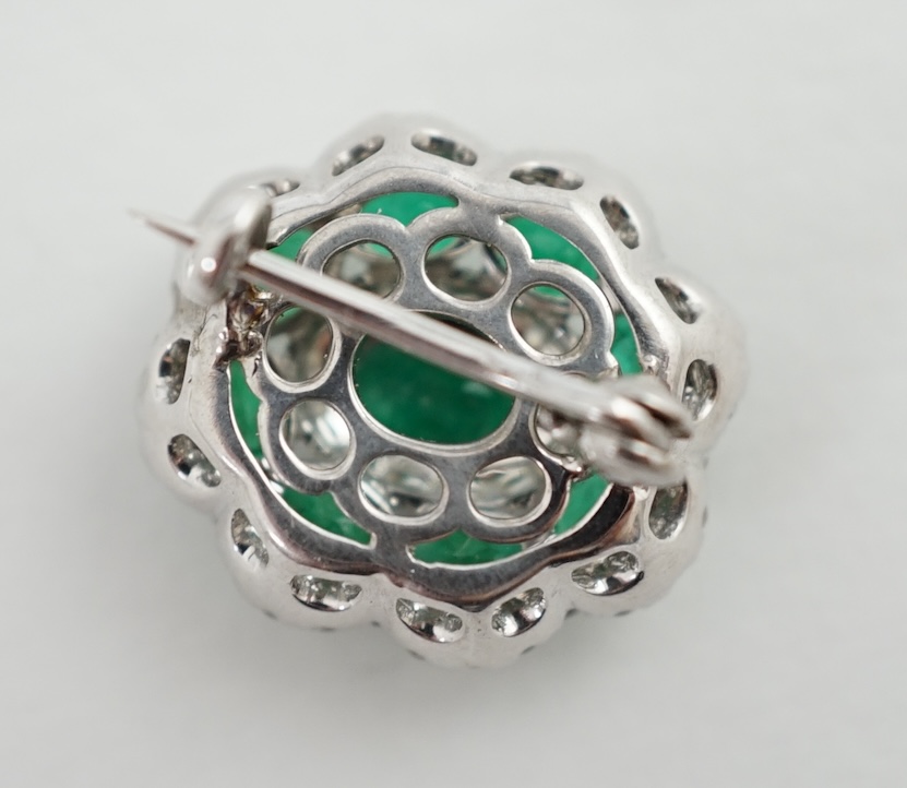 A mid to late 20th century white gold, emerald and diamond cluster set brooch